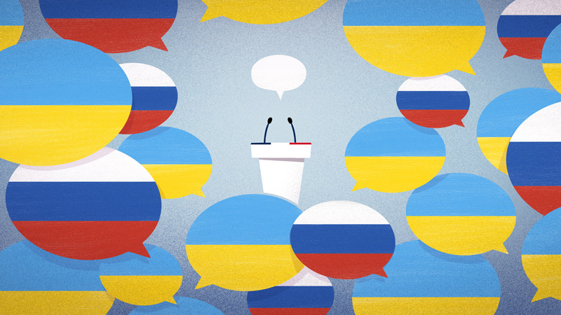 Un pupitre portant les couleurs de la France est entouré de bulles aux couleurs de la Russie et de l'Ukraine